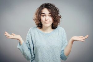woman with both hands raised on the side depicting how much heating oil will I use a day