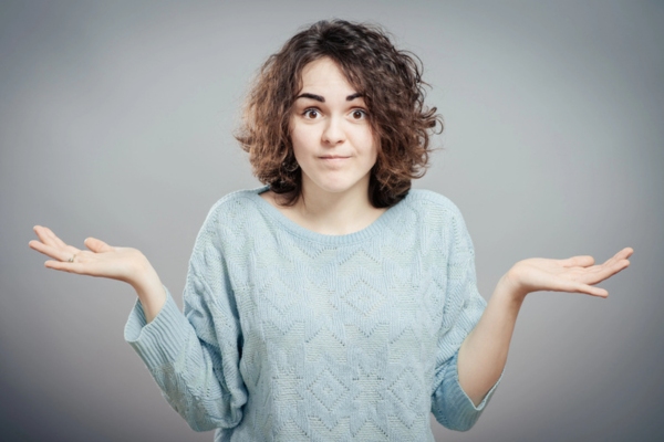 woman with both hands raised on the side depicting how much heating oil will I use a day