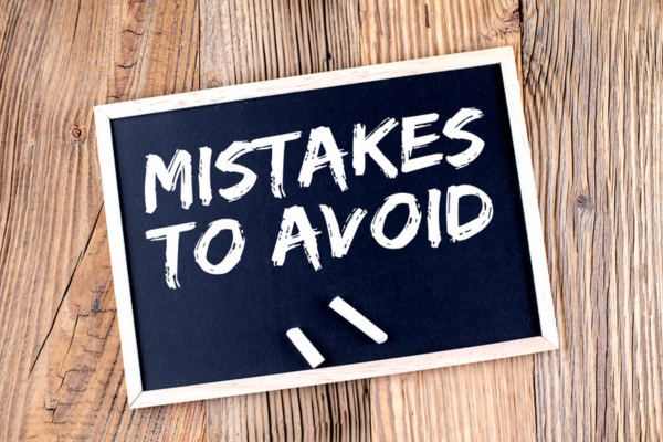mistakes to avoid written on a chalkboard depicting Replacing Your Heating System