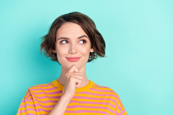 woman with hand on her chin while thinking depicting How to Tell If Your HVAC Blower Motor Needs Replacing