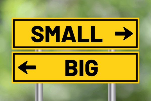 Small or big road sign on blur background