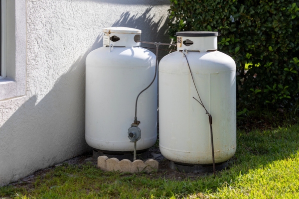 propane tanks hidden at the back of house behind the plants